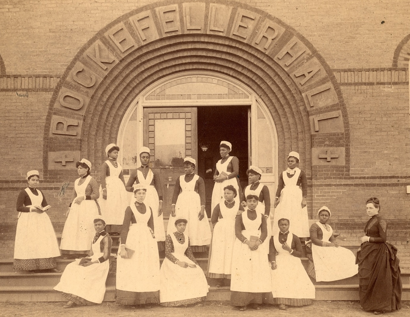 Spelman College Nursing Graduates proudly standing in front of Rockefeller Hall